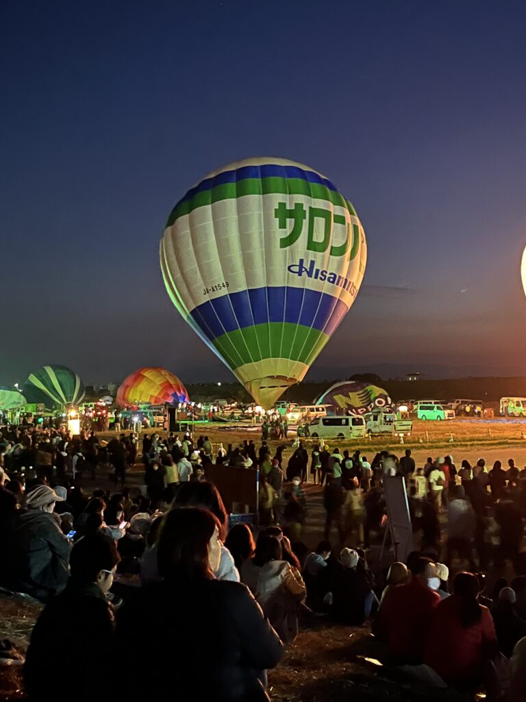 One of two Salonpas-branded balloons inflating in preparation for La Montgolfier Nocturne (Night Mooring), the highlight of the Saga International Balloon Fiesta